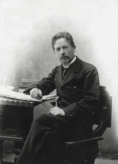 Photograph of Anton Chekhov at his writing desk, 1889 — author of The Lady with the Dog and Ward No. 6